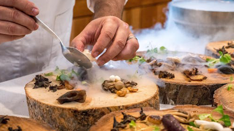 Elderly people being served at a restaurant